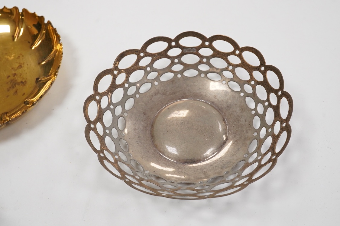An Elizabeth II silver gilt small dish, by C.J. Vander Ltd, London, 1964, 10cm, a pair of pierced silver bonbon dishes and a small silver Tudor Rose dish, 6.4oz.